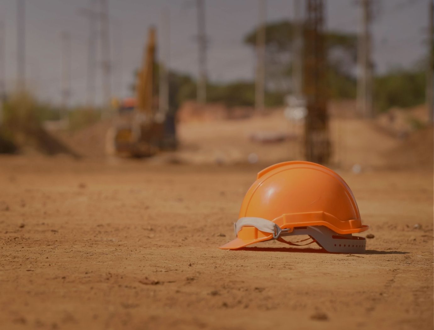 Construction workers wearing PPE during a site safety meeting